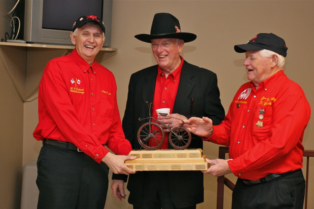 Mike Rogala told the best joke on the weekend and is presented the Bombay Bicycle Club trophy by Don Fanstone and Ian Anderson